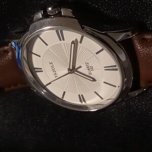 Quartz 332 extra large bezel for easy viewing. Genuine leather band. stainless